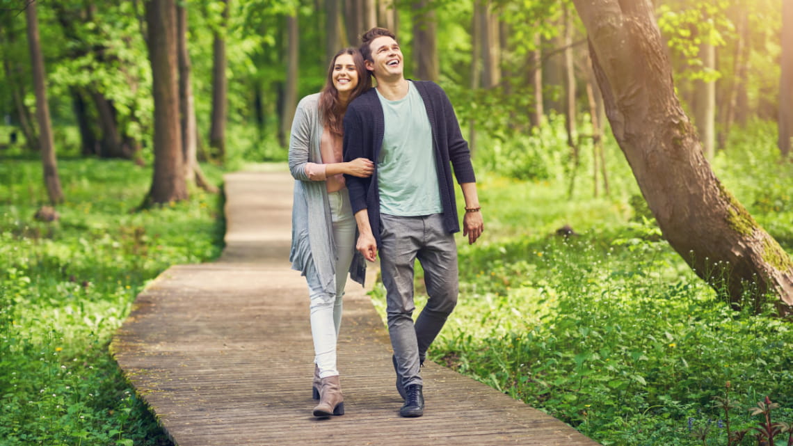 A group of people participating in an outdoor yoga session.